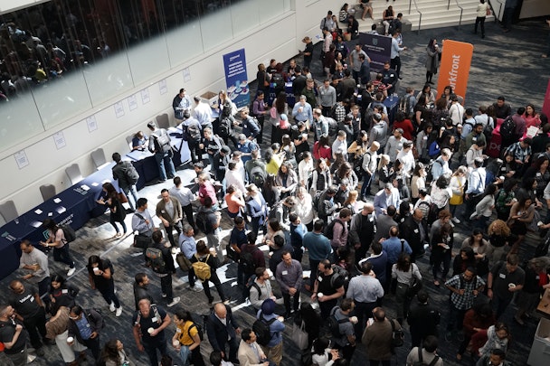 Attendees at a busy expo, seen from above