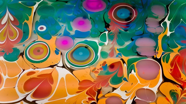 A kaleidoscopic mixture of paint colors