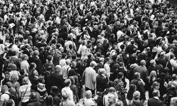 A black-and-white photograph of a large crowd of people