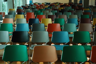 Rows of multi-colored empty chairs