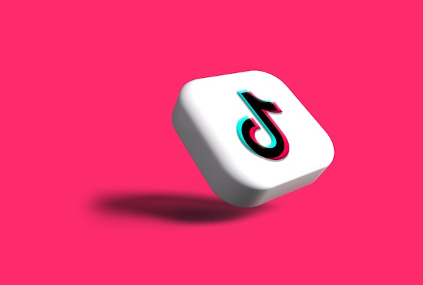 The TikTok logo on a pink background