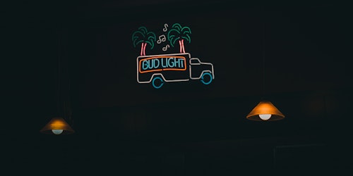 A neon sign that reads 'Bud Light'