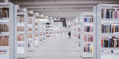 The stacks of a clean, modern library