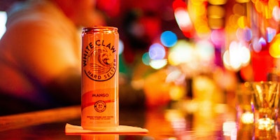 A white claw can on a bar