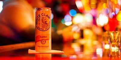 A white claw can on a bar