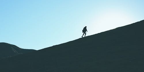 Someone climbing a mountain Someone climbing a mountain