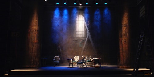 A backlit stage set up for a musical performance
