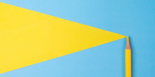 A yellow pencil on a brightly colored background