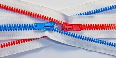 Two intertwined zips, one red; one blue