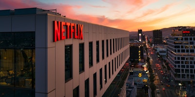 The Netflix logo on a building during a California sunset