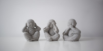 Three statues in the "see no evil, hear no evil, speak no evil" formation