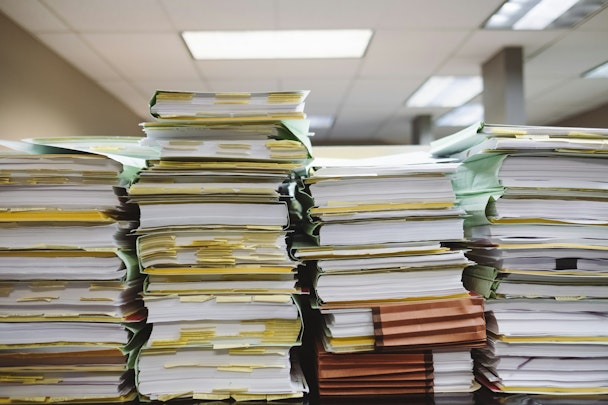 Piles of paper on a desk