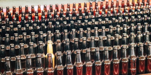 Bottles of bear, with one standing out