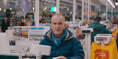 TV presenter Kevin McCloud at the till in a Sainsbury's store