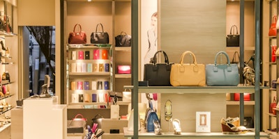 How should luxury brands should respond to the living cost crisis?