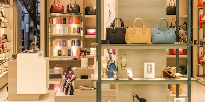 How should luxury brands should respond to the living cost crisis?