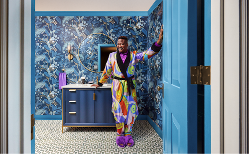 Tituss Burgess in a brightly colored bathroom