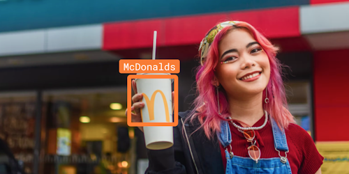 Girl holding McDonald's cup