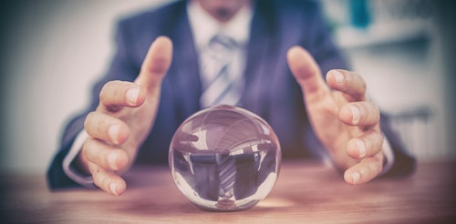 a man in a suit with a crystal ball