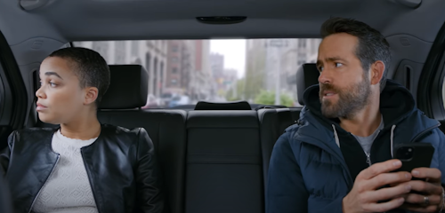 ryan reynolds and assistant in a car