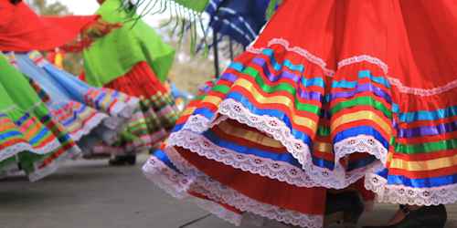 people wearing traditional mexican dresses