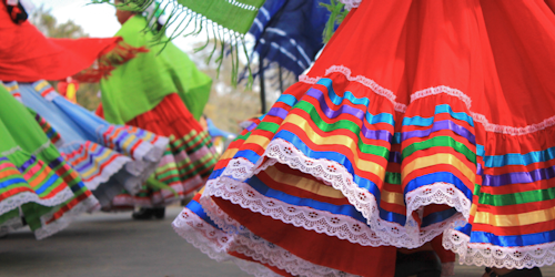 people wearing traditional mexican dresses
