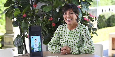 kris jenner poses with the amazon glow