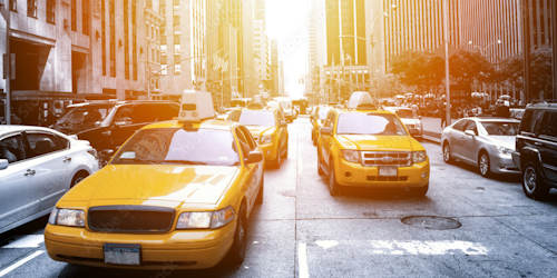 taxi cabs on a street in new york city