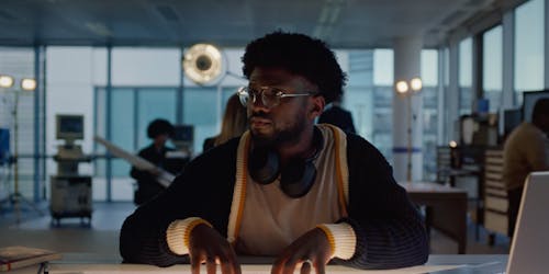 man sitting at a desk man sitting at a desk
