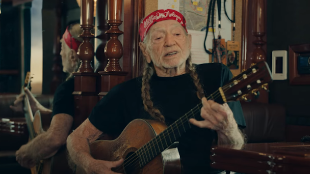 willie nelson with a guitar