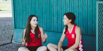 Two girls in sports kits