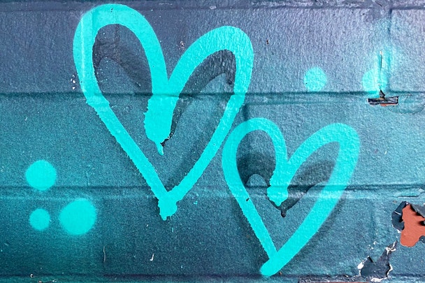 Blue love heart graffiti on wall
