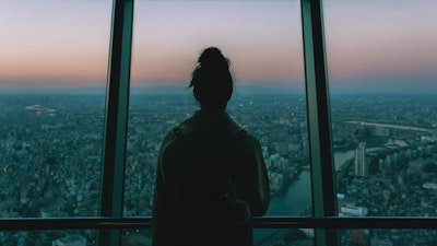 Woman looking overTokyo skyline
