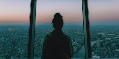Woman looking overTokyo skyline