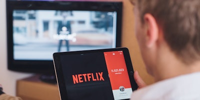 Man using Netflix on iPad