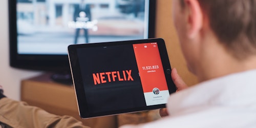 Man using Netflix on iPad