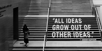 Quote painted on steps: "All ideas grow out of other ideas"