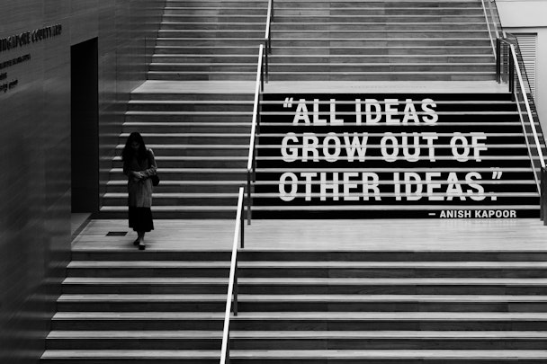Quote painted on steps: "All ideas grow out of other ideas"