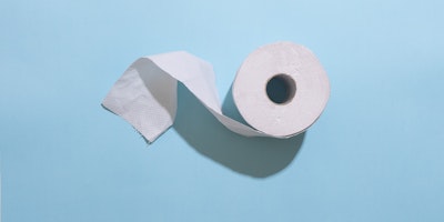 Toilet paper on light blue background