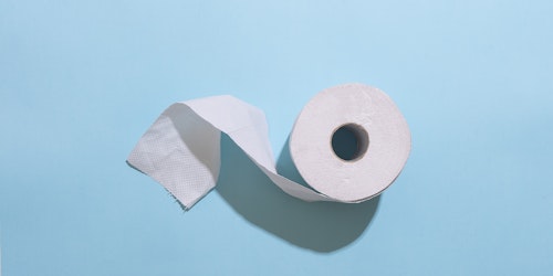 Toilet paper on light blue background