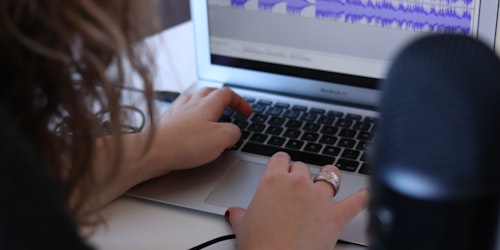 Woman using audio editing software