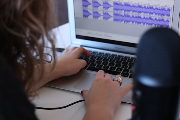 Woman using audio editing software