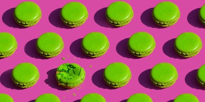Green cookies on pink background