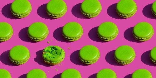 Green cookies on pink background