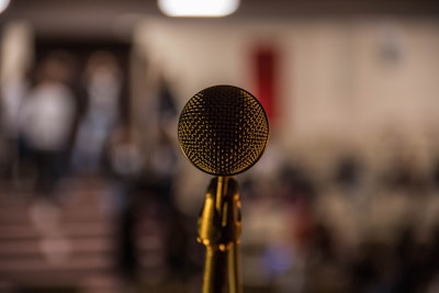 Selective focus shot of brass-colored microphone