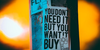 Poster reads: 'you don't need it but you want it'