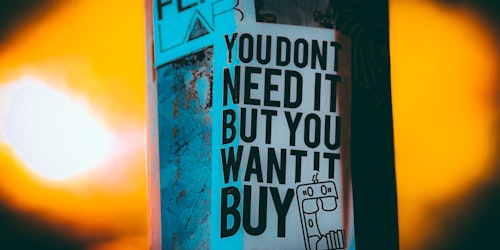 Poster reads: 'you don't need it but you want it'