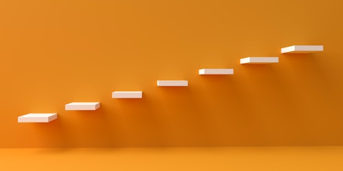 3D image of white ascending steps against orange background