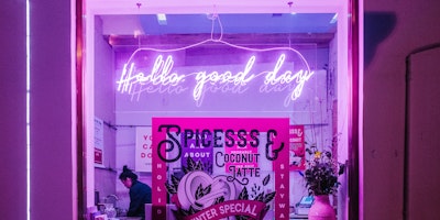 Glowing shop sign reading 'hello good day'