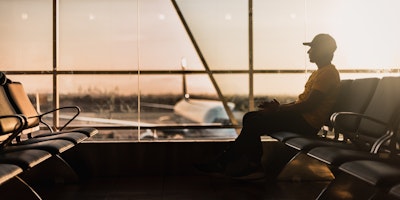 Man sitting in airport lounge